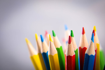 Pencils colorul color wooden pencil in metal holder in front of wall background