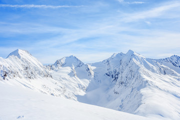 Fototapeta na wymiar Mauntain glacier panoramic snow top panoramic view with blue cloudy sky