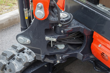 Detail of hydraulic piston excavator arm with articulation joint swivel frame modern tractor © pavel_812