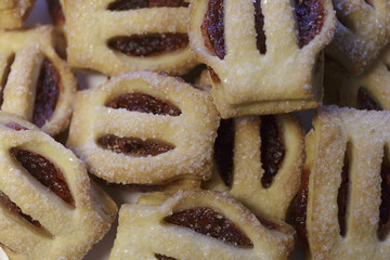 Cookies with strawberry jam, isolated on white background closeup.