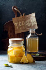 Fermented mexican pineapple Tepache. Homemade raw kombucha tea with pineapple. Healthy natural probiotic flavored drink. Copy space