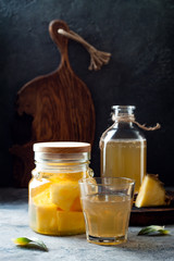 Fermented mexican pineapple Tepache. Homemade raw kombucha tea with pineapple. Healthy natural probiotic flavored drink. Copy space