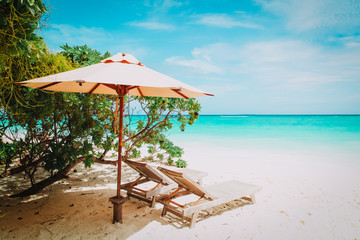 Two beach chairs on tropical vacation