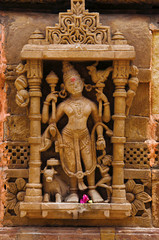 Carved idol on the outer wall, Hatkeshwar Mahadev, 17th century temple, the family deity of Nagar...