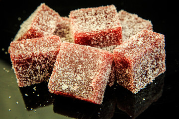 raspberry marmalade on black mirror background