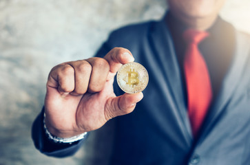 Businessman holding Bitcoin.