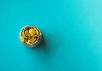 Gold coins on blue paper background,Chinese new year concept