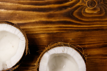 Fresh ripe coconut on rustic wooden table