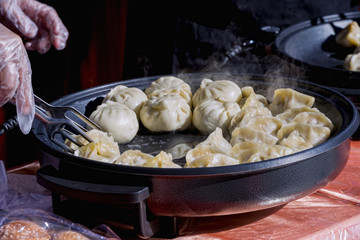 Close-up cooking at a street market of Chinese food