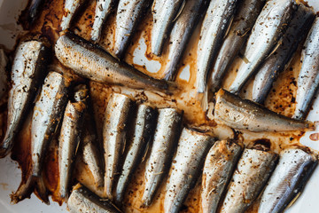 Roasted baltic herring on white plate