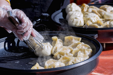 Close-up cooking at a street market of Chinese food