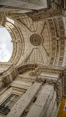 Looking up at Arc Augusta, Arc de Triomphe, Lisbon, Portugal. Lisbon is continental Europe's...