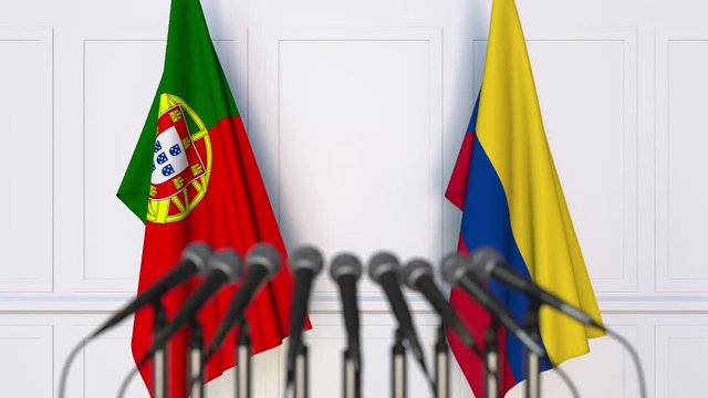 Flags of Portugal and Colombia at international meeting or negotiations press conference