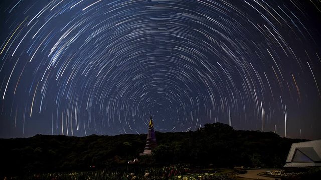 Star trail shot at Doi Intanon, Chiang Mai, Thailand. A star trail is a type of photograph that utilizes long-exposure times to capture the motion of stars in the sky due to the rotation of the Earth.