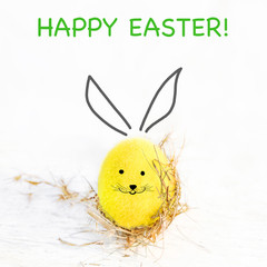 Easter Eggs with handmade painted bunny face. Happy Easter! Festive decoration with copy space..