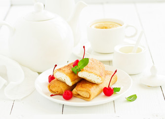 Russian crepes stuffed with curd and cherry.