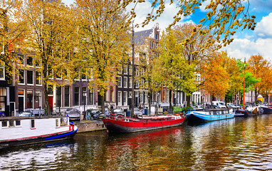 Fototapeta na wymiar Channel in Amsterdam Netherlands houses river Amstel landmark