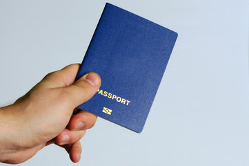 Blue passport in the hands of a man. Isolate