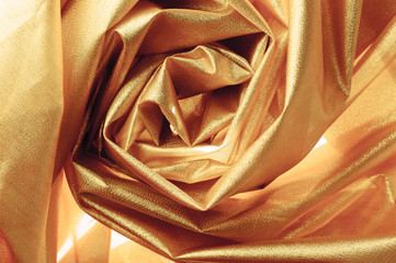 gold closeup organza fabric wavy texture