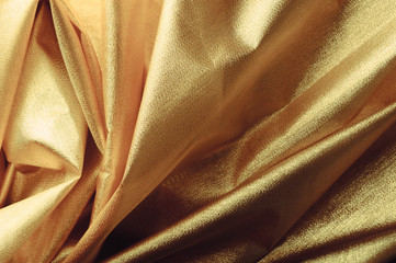 gold closeup organza fabric wavy texture