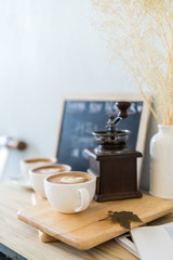 coffee cup on old wood table,coffee lover background concept,selective focus on single coffee cup.