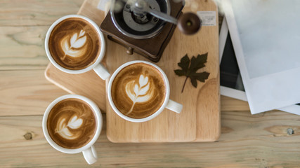 coffee cup on old wood table,coffee lover background concept,selective focus on single coffee cup.