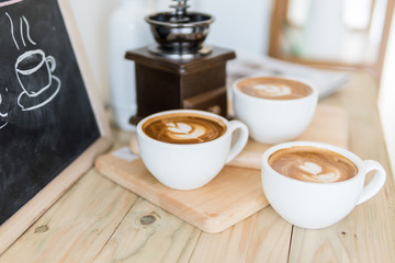 coffee cup on old wood table,coffee lover background concept,selective focus on single coffee cup.