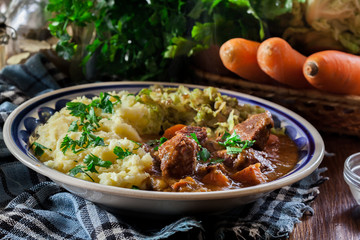 Traditional irish stew served with potatoes and cabbage
