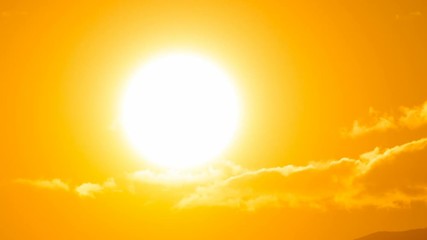 Time lapse of the sun rising from behind the mountains