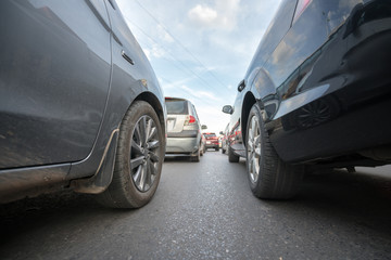 Cars on city street in traffic jam at rush hour