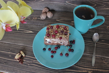 Walnut cake with tea, on a blue platter.