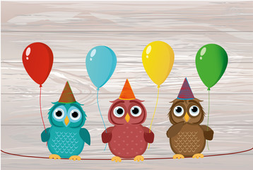 Three cute colored owls sitting on a rope and holding balloons. 
