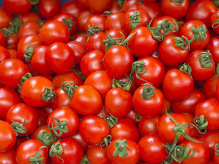 red fresh, freshly harvested tomatoes sold in the market