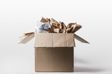 close up view of cardboard box with papers inside isolated on white