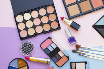 Cosmetic products on pastel colors background