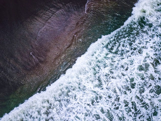 View of the ocean from above. Radially split in half a frame. Aerial view