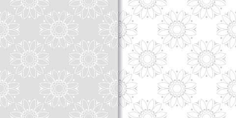 Light gray floral ornamental designs. Set of seamless patterns