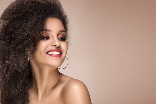 Beauty portrait of smiling sensual afro girl.