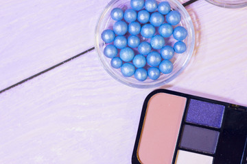 Cosmetic products on white wooden background