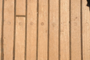 Wood teak texture on the deck of a classic sail boat