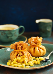 Russian pancakes stuffed with apples and caramel.