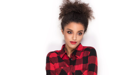 Afro girl in red checkered shirt.