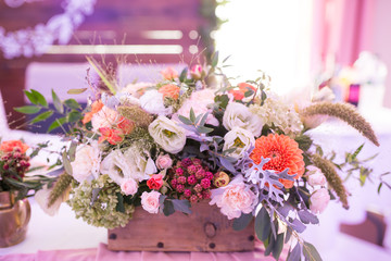 Rustic flower arrangement at a wedding banquet. Table set for an event party or wedding reception.