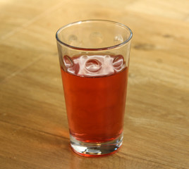 Glass with fresh Strawberry lemonade on wooden background
