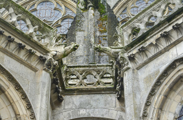 Two gargoyles on the walls of a cathedral of Saint Julien at Le mans