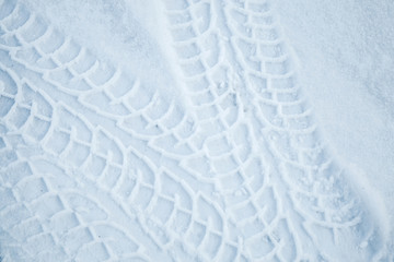 Tire tracks pattern on winter road with snow