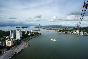 Fototapeta premium Halong city aerial view with Bai Chay bridge in Quang Ninh province, Vietnam