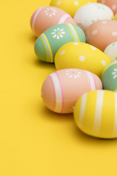 Painted easter eggs on a bright yellow background