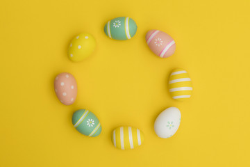 Painted easter eggs on a bright yellow background