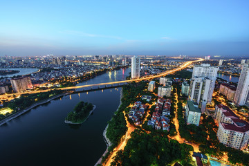 Aerial skyline view of Hanoi cityscape at twilight. Linh Dam peninsula, Hoang Mai district, Hanoi, Vietnam